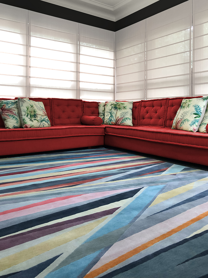 Eclectic, bold, crossed lines, rainbow colours, wool rug